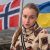Катерина Станіславська на фоні прапорів України та Норвегії